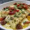 Delicious White Fish Puttanesca served with tomatoes, olives, and capers.