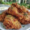 Air fryer crispy fried chicken served on a plate with dipping sauce