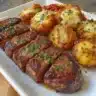 Air fryer cubed steak served with crispy golden potatoes