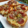 Freshly made Air Fryer Pizza Bagels topped with cheese and pepperoni