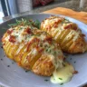 Cheesy Hasselback Potatoes cooked in an Air Fryer, golden and crispy.