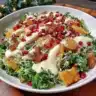 A vibrant Citrus Pomegranate Kale Salad with fresh ingredients and colorful toppings.