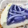 Sliced butterfly pea jelly pie with airy layers of creamy coconut filling at Chim Chim NYC.