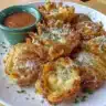 Healthy mini air fryer blooming onion served with dipping sauce