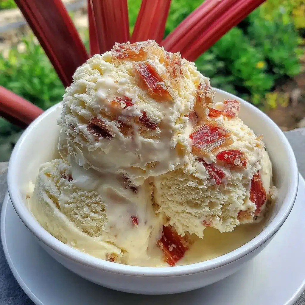 Delicious bowl of homemade rhubarb ice cream topped with fresh rhubarb slices.