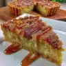 Slice of Sweet Rhubarb Custard Tart with fresh rhubarb on top