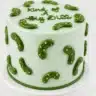 Deliciously decorated Pickle Cake with playful green pickle-inspired details.