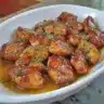 Bourbon Chicken dish garnished with green onions on a plate