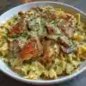 Delicious Chicken Stroganoff served on a plate with noodles and garnished with parsley.