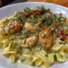 Delicious Chicken Stroganoff served with noodles and garnished with parsley