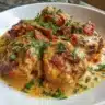 Delicious Cowboy Butter Chicken served with rice and garnished with herbs.