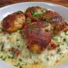 Plate of smothered chicken with rice and gravy