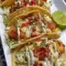 Baked Chicken Bacon Ranch Tacos served on a plate with toppings