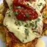 Deliciously baked chicken parmesan served with marinara sauce and cheese