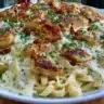 Delicious Chicken Fettuccine Alfredo with creamy sauce and fresh parsley on top