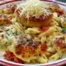 Delicious Chicken Mozzarella Pasta topped with melted mozzarella and herbs.