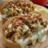Delicious Chicken Philly Cheese Steaks served with melted cheese and fresh veggies