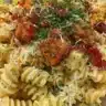 Delicious plate of Crack Chicken Pasta topped with herbs and cheese