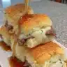 Homemade French Dip Sliders served with savory au jus for dipping.