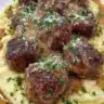 Slow cooker Salisbury steak meatballs served with rich gravy and mashed potatoes