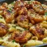 Plate of Sticky Smoky Garlic Butter Chicken Pasta garnished with herbs
