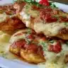 Delicious Texas Roadhouse Smothered Chicken topped with savory sauce
