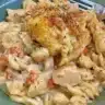 Crock Pot Chicken Pot Pie Pasta served in a bowl with ingredients around it.
