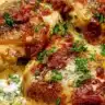 Crock Pot Marry Me Chicken served on a plate with herbs and side dishes