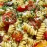 Colorful and refreshing pasta salad in a bowl, perfect for summer meals.