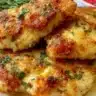 Delicious Melt in Your Mouth Chicken recipe on a plate garnished with herbs.