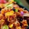 Colorful Taco Pasta Salad with fresh ingredients and toppings