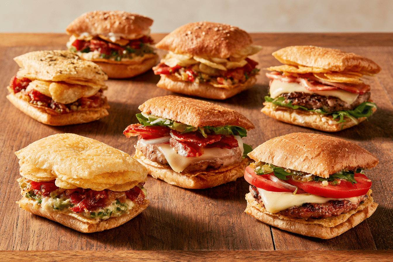 A variety of customized chip bag sandwiches with different fillings and chip flavors, showcasing creative variations beyond the classic Caesar.