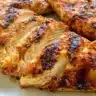 Delicious air fryer grilled chicken breasts plated with herbs and spices.
