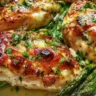 Delicious baked chicken served with fresh asparagus on a plate