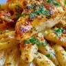 Creamy Cajun chicken pasta dish with vibrant spices and rich sauce