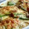 Creamy chicken bake with asparagus served in a stylish dish.