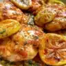 Plate of easy lemon dill chicken garnished with fresh herbs