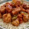 Delicious homemade General Tso Chicken served with rice and vegetables