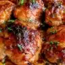 Delicious Honey Garlic Chicken Thighs plated with fresh vegetables