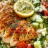 Lemon Herb Greek Chicken Bowl served with fresh vegetables and rice