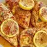 Juicy Lemon Pepper Chicken garnished with fresh herbs