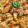 Delicious Marry Me Chicken Pasta served on a white plate with garnishes.
