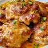 Skillet Bang Bang Chicken Thighs served with rice and vegetables