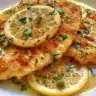 Delicious Chicken Piccata with Lemon Sauce served on a white plate