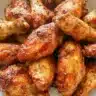Crispy air fryer chicken wings served on a plate with dipping sauces
