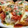 Crispy air fryer chicken parmesan garnished with fresh herbs
