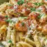 One pot creamy parmesan chicken pasta dish with herbs and cheese