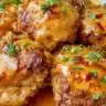 Skillet Bang Bang Chicken Thighs in a frying pan, garnished and ready to serve.