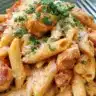 Delicious Southwest Alfredo Penne Pasta served in a bowl with herbs
