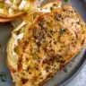 Apple & brie stuffed chicken dish served on a plate